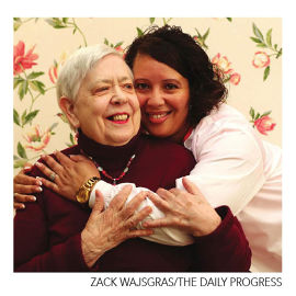 nurse hugging a patient